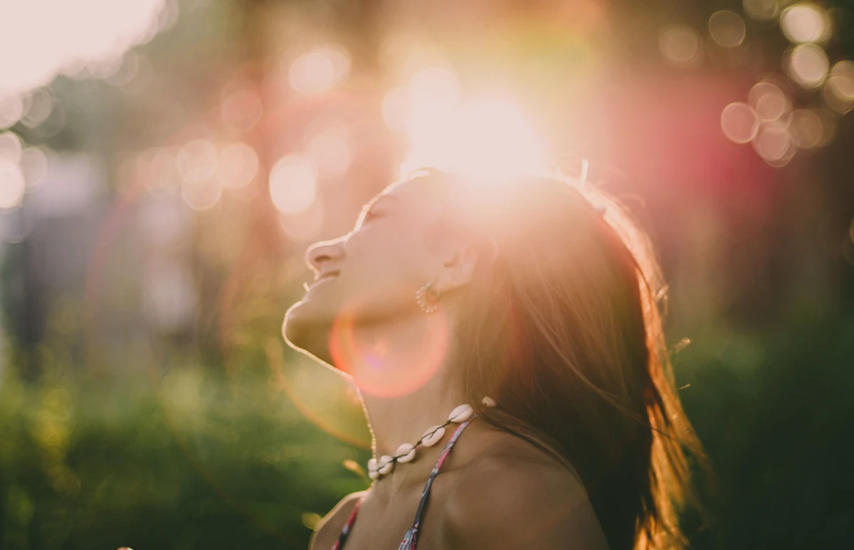 Happy young woman smiling after finding relief through virtual mental health counseling