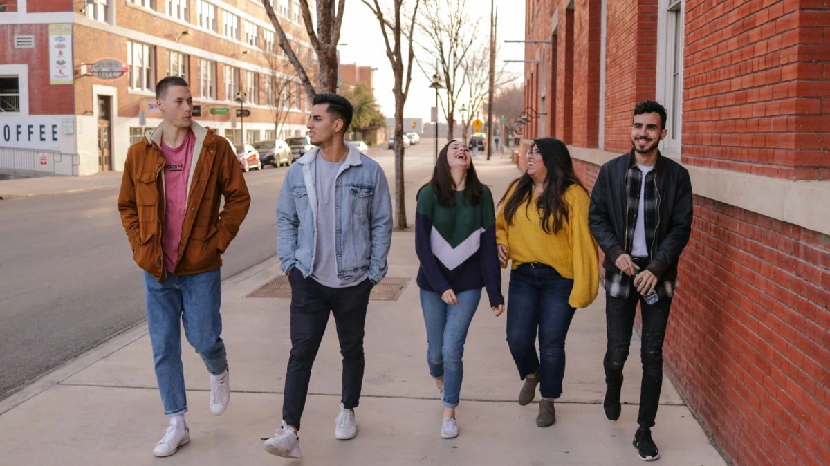 Smiling teenagers engaged in open communication and building healthy relationships through therapy