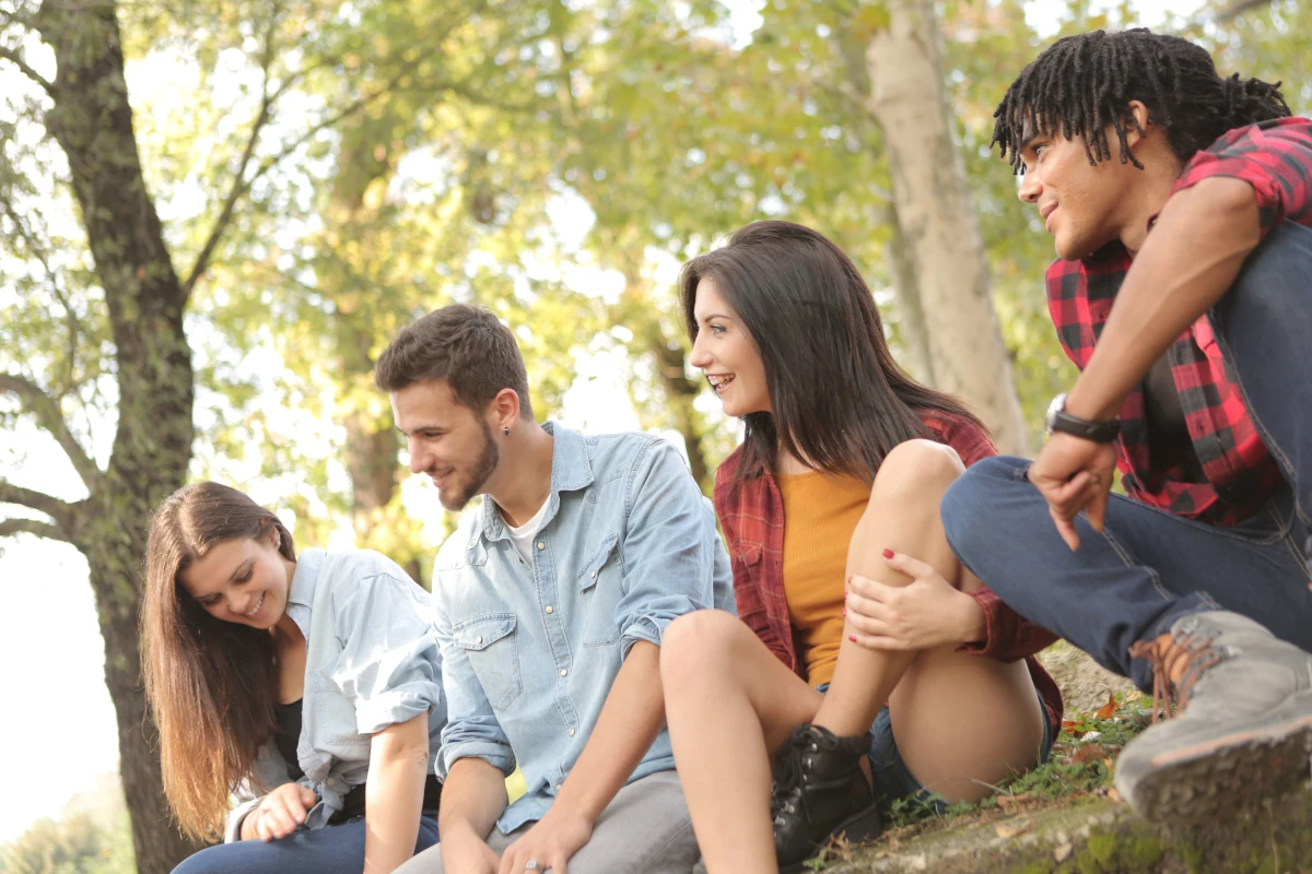 Happy young adults talking and connecting